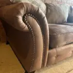 DFS brown 2 seater Pillow Back sofa with footstool