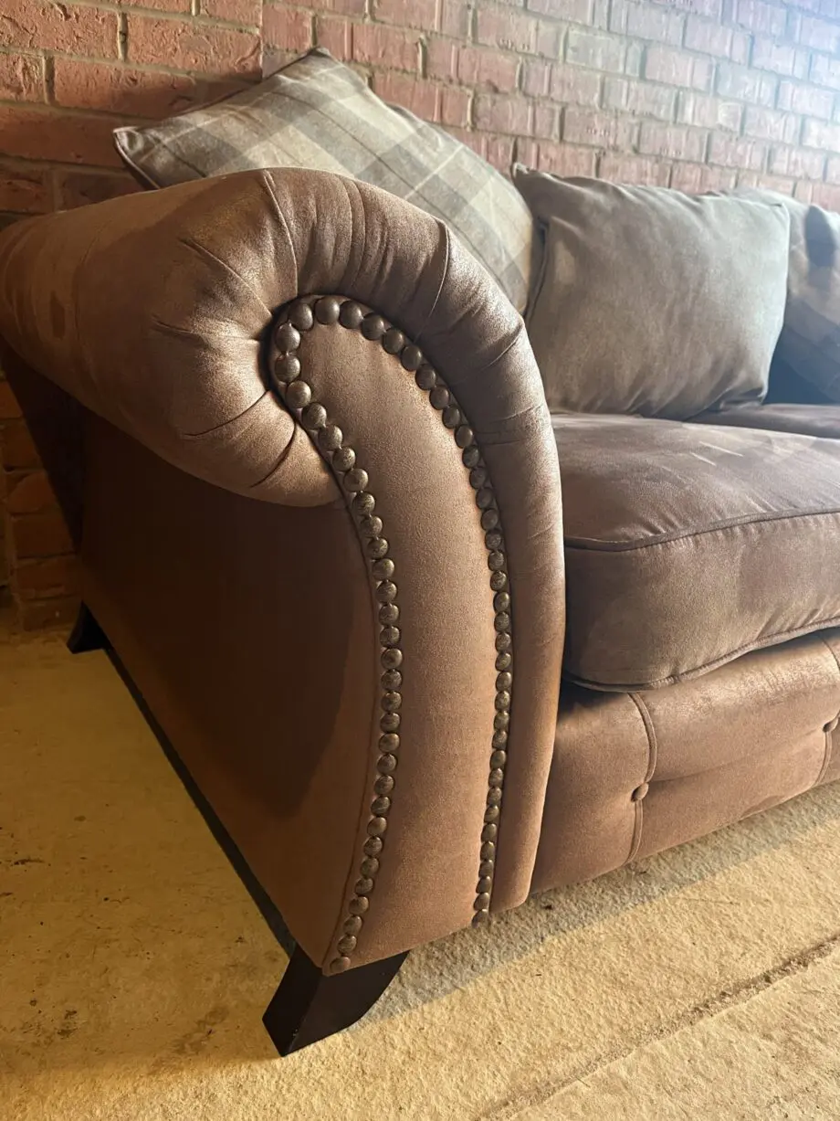 DFS brown 2 seater Pillow Back sofa with footstool