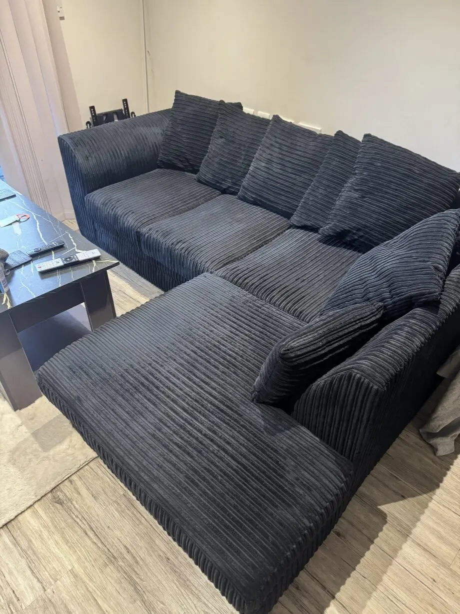 Black L shaped corner sofa