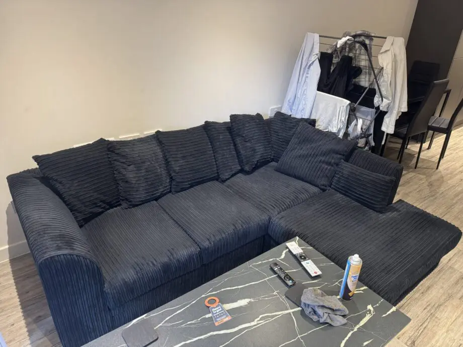 Black L shaped corner sofa
