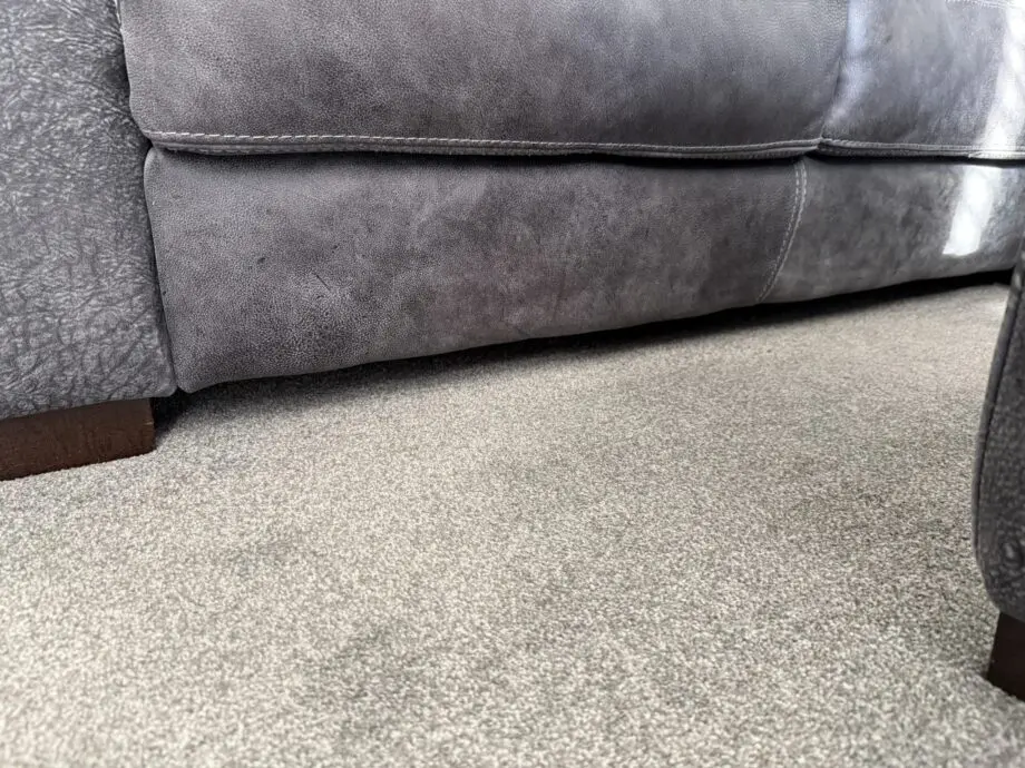 DFS Grey leather Caesar corner sofa and footstool
