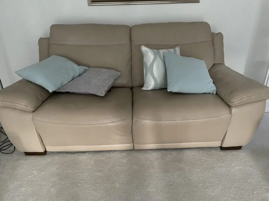 Beige leather sofa set. Purchased from Glasswells furniture store. Set comprises of one three seater sofa ( non recliner) and a two seater electric recliner