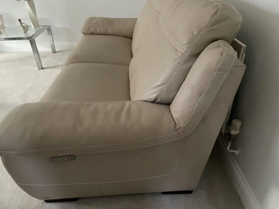Beige leather sofa set. Purchased from Glasswells furniture store. Set comprises of one three seater sofa ( non recliner) and a two seater electric recliner