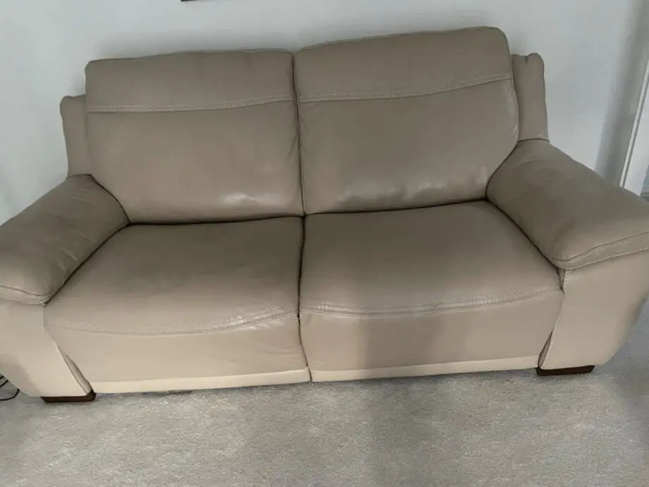 Beige leather sofa set. Purchased from Glasswells furniture store. Set comprises of one three seater sofa ( non recliner) and a two seater electric recliner