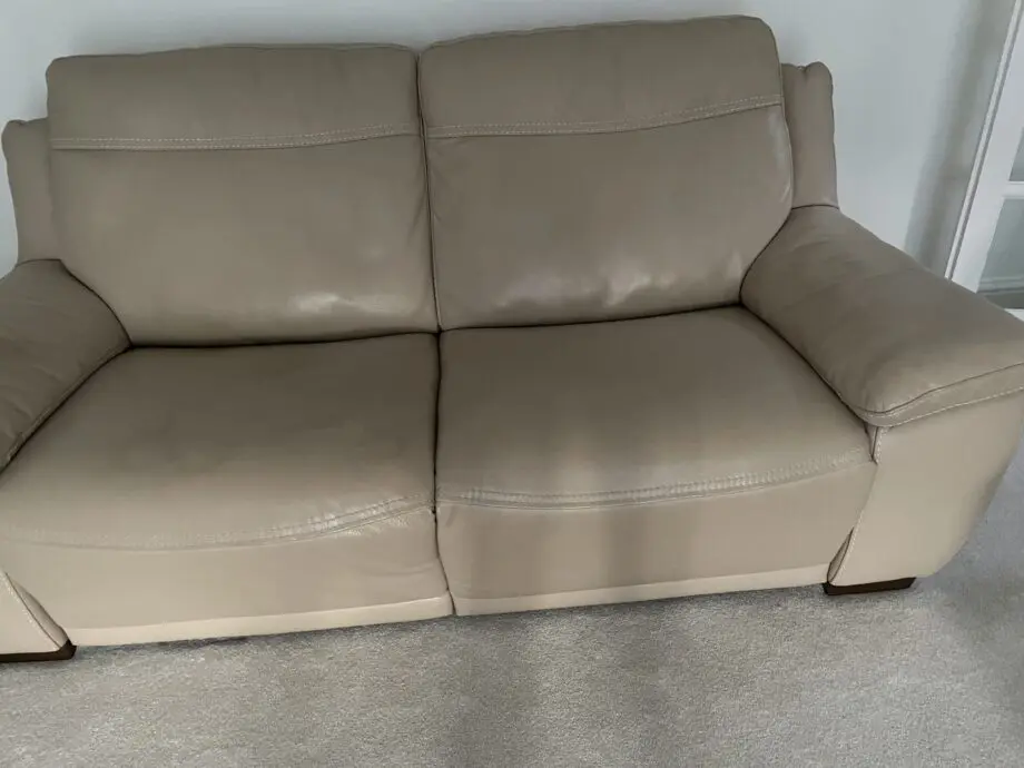 Beige leather sofa set. Purchased from Glasswells furniture store. Set comprises of one three seater sofa ( non recliner) and a two seater electric recliner