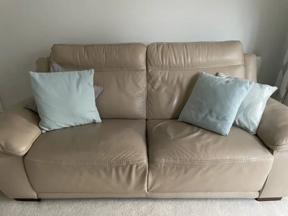 Beige leather sofa set. Purchased from Glasswells furniture store. Set comprises of one three seater sofa ( non recliner) and a two seater electric recliner