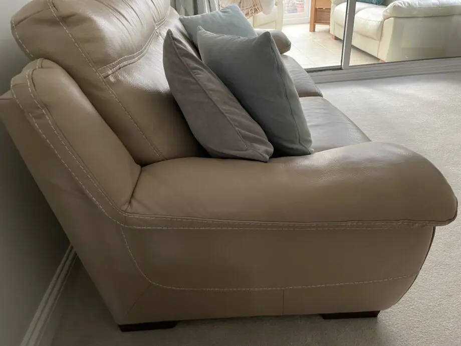 Beige leather sofa set. Purchased from Glasswells furniture store. Set comprises of one three seater sofa ( non recliner) and a two seater electric recliner