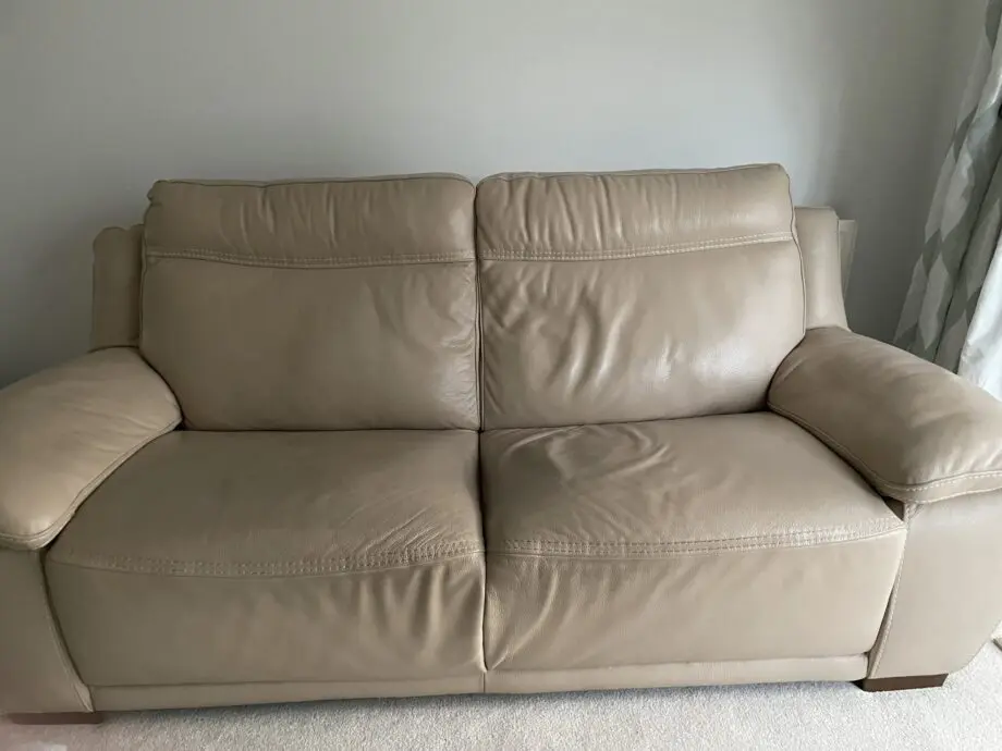 Beige leather sofa set. Purchased from Glasswells furniture store. Set comprises of one three seater sofa ( non recliner) and a two seater electric recliner