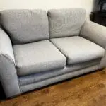 Grey two seater sofa