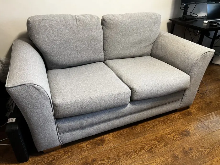 Grey two seater sofa