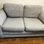 Grey two seater sofa