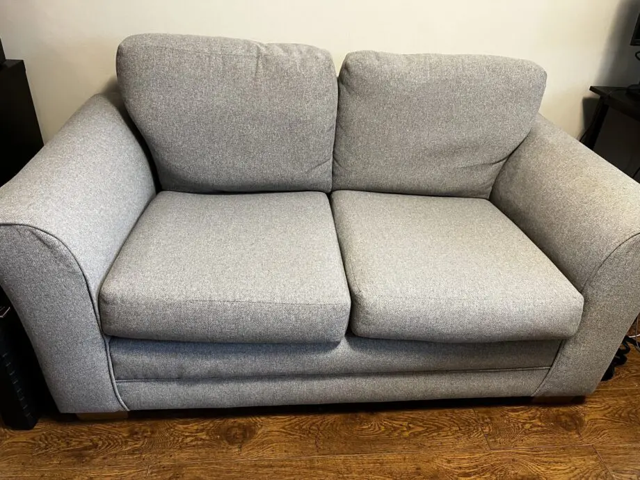 Grey two seater sofa