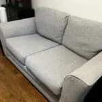 Grey two seater sofa