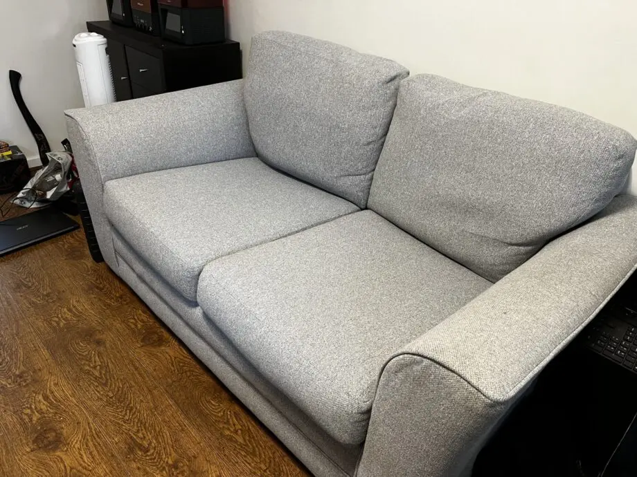 Grey two seater sofa