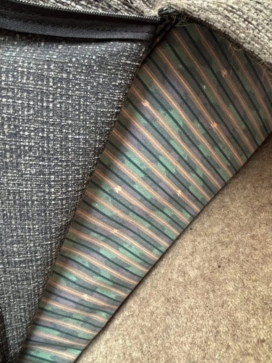 Pre-loved contemporary Grey Arm chair includes loose covers. Good condition.
