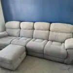 Sofology Grey Radley 4 seater sofa with dual recliner and storage footstool