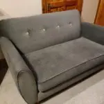 Grey w/yellow accents, two-person sofa