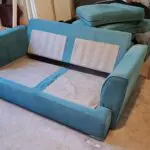 DFS Blue 2 Seater Sofa Bed and Footstall