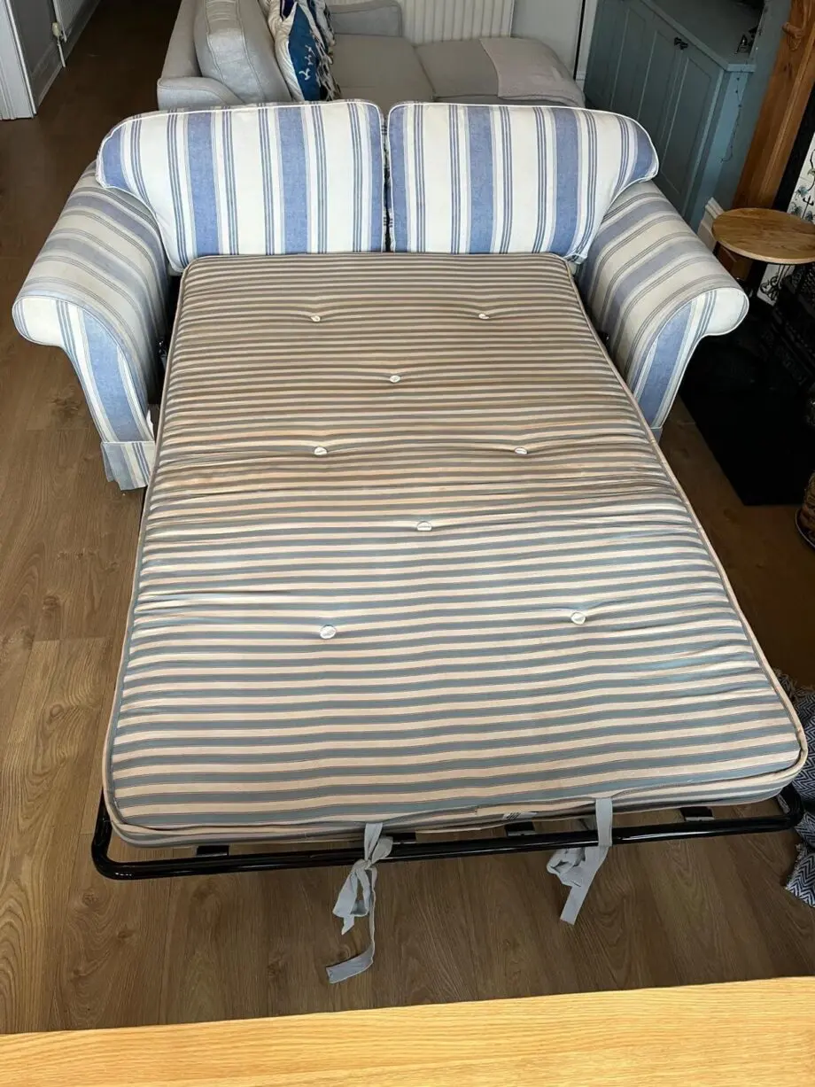 Laura Ashley blue and cream striped sofa bed