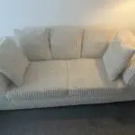 Beige 2 seater sofa
