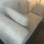 Beige 2 seater sofa
