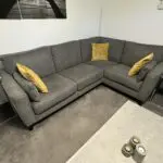 2 x Grey Bronby Right Hand Corner Sofas from Furniture VIllage, 3 yrs old, excellent condition as new, and storage footstool