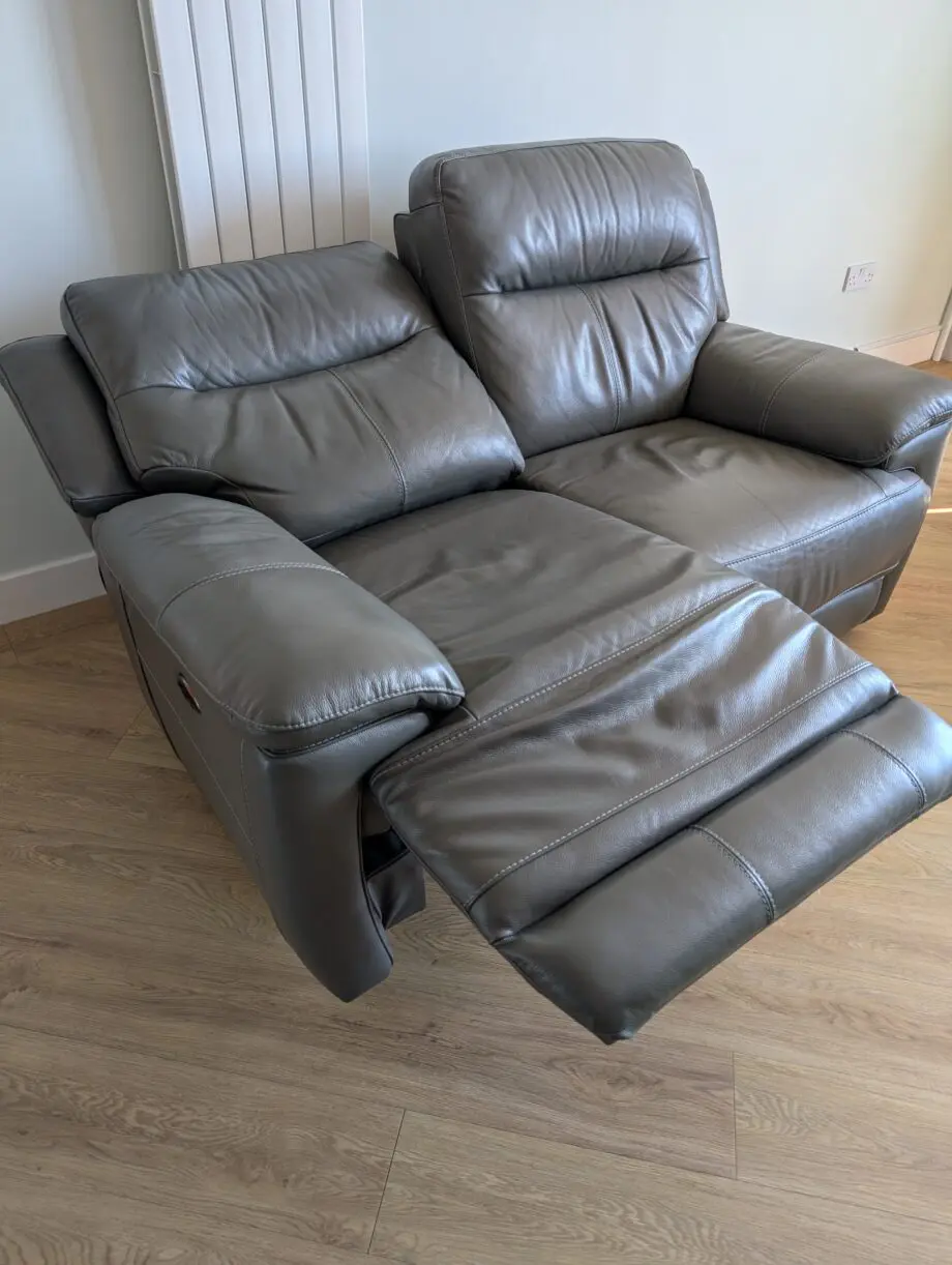 DFS Grey leather 2 seater electric recliner sofa