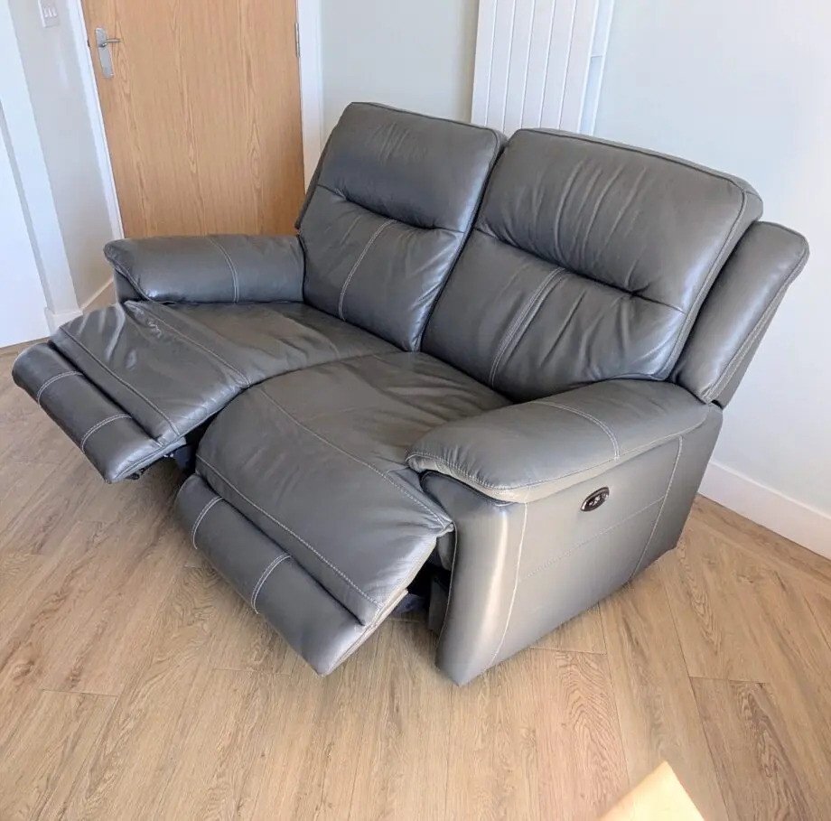 DFS Grey leather 2 seater electric recliner sofa
