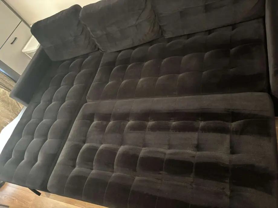 Black sofa bed with pouffe