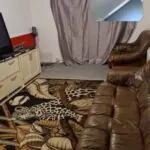 Brown leather sofa and foot stool
