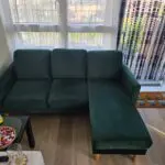 L shaped emerald green sofa