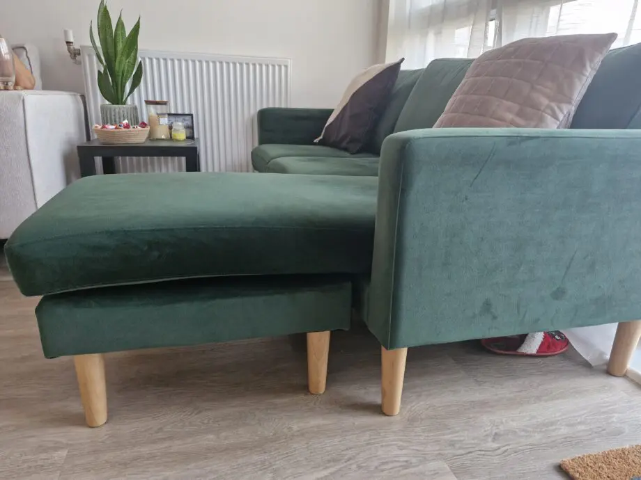 L shaped emerald green sofa