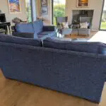 Pair of blue three seater sofas