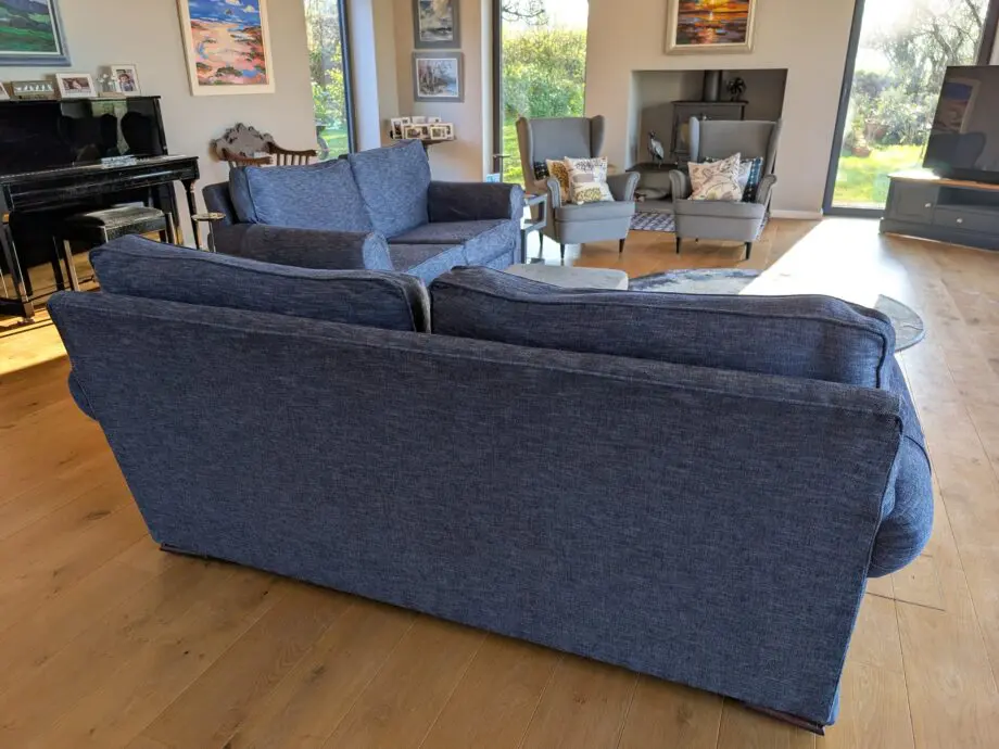 Pair of blue three seater sofas