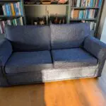 Pair of blue three seater sofas