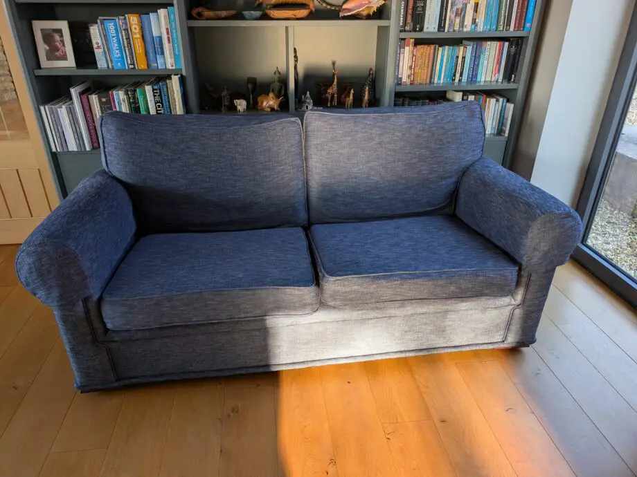 Pair of blue three seater sofas