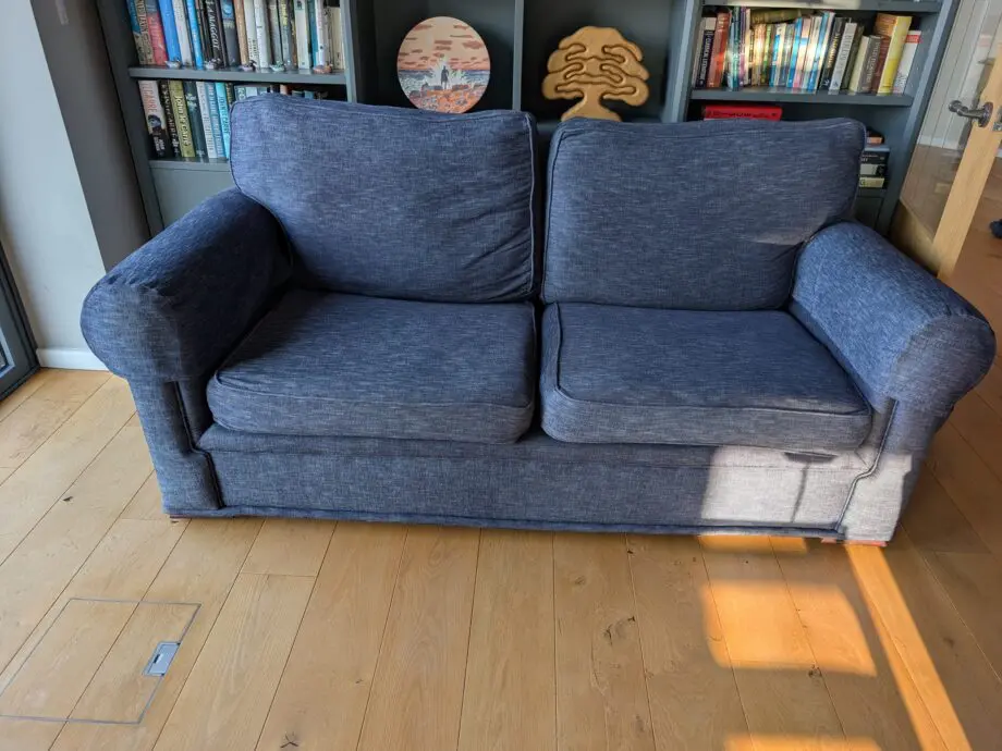 Pair of blue three seater sofas