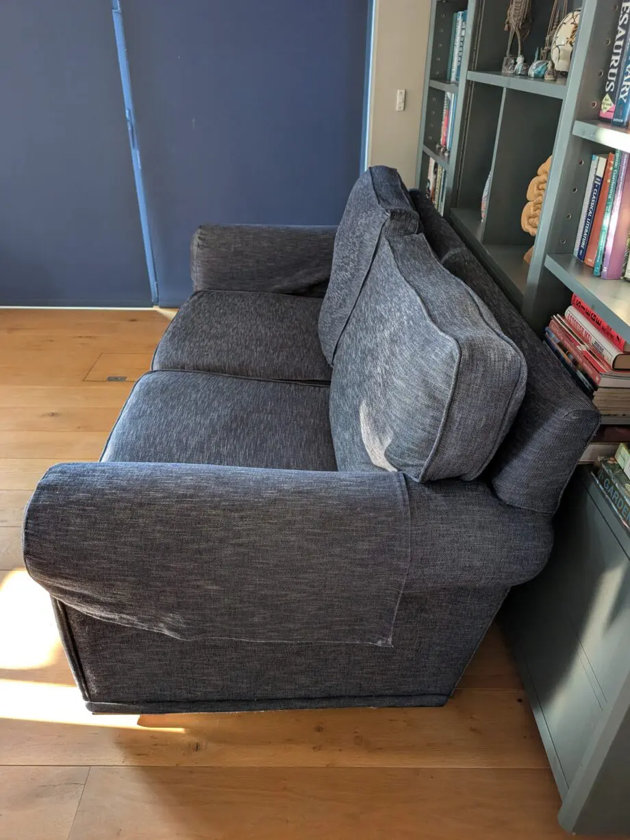 Pair of blue three seater sofas
