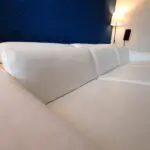 White Leather Nicoletti Italian 4 seat sofa with chaise long and powered recliner