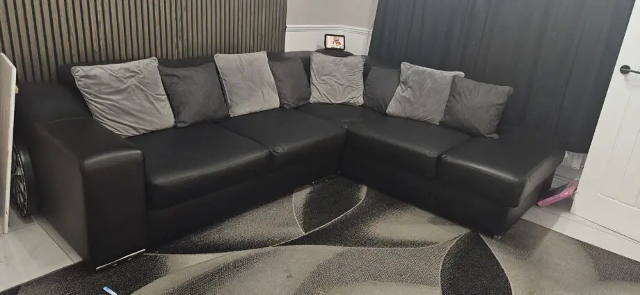 Black right hand corner sofa