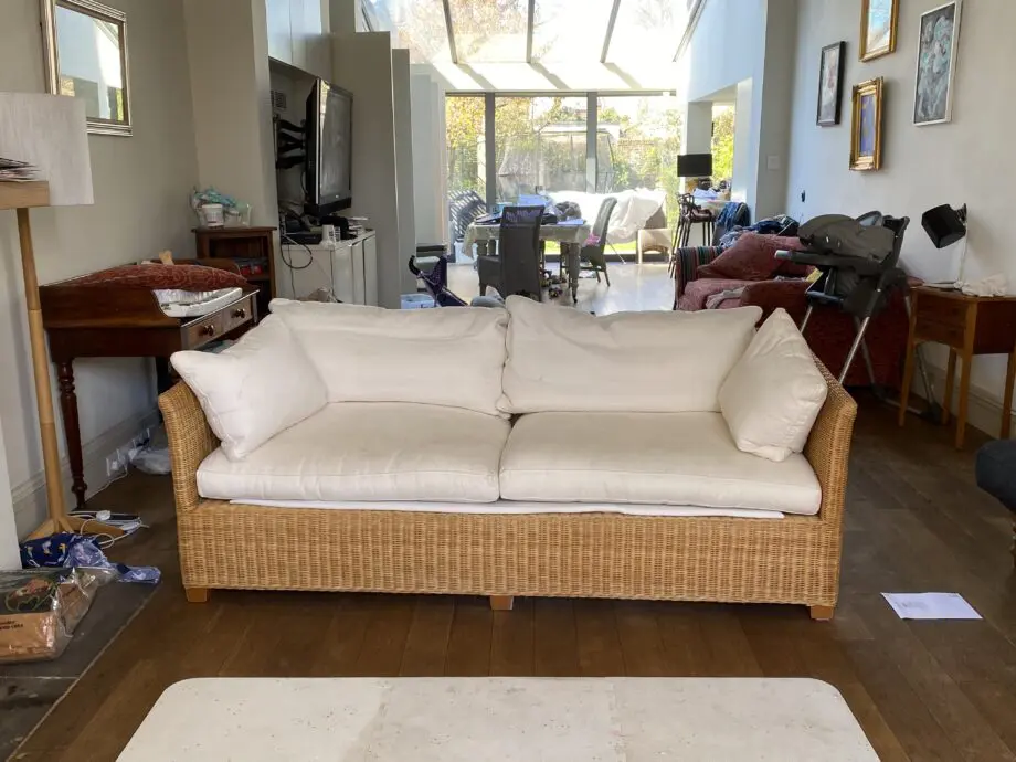 John Lewis 4 seater rattan sofa with white cushions