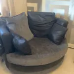 Grey and black corner sofa and round swivel chair