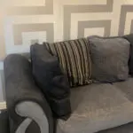 Grey and black corner sofa and round swivel chair