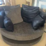 Grey and black corner sofa and round swivel chair