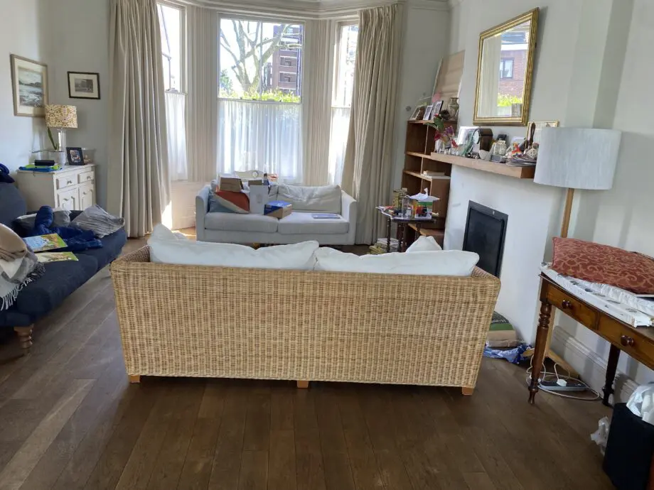 John Lewis 4 seater rattan sofa with white cushions