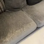 Grey and black corner sofa and round swivel chair