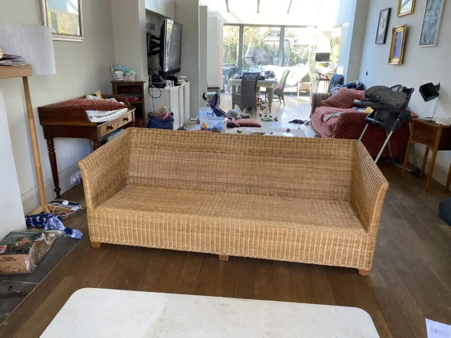 John Lewis 4 seater rattan sofa with white cushions