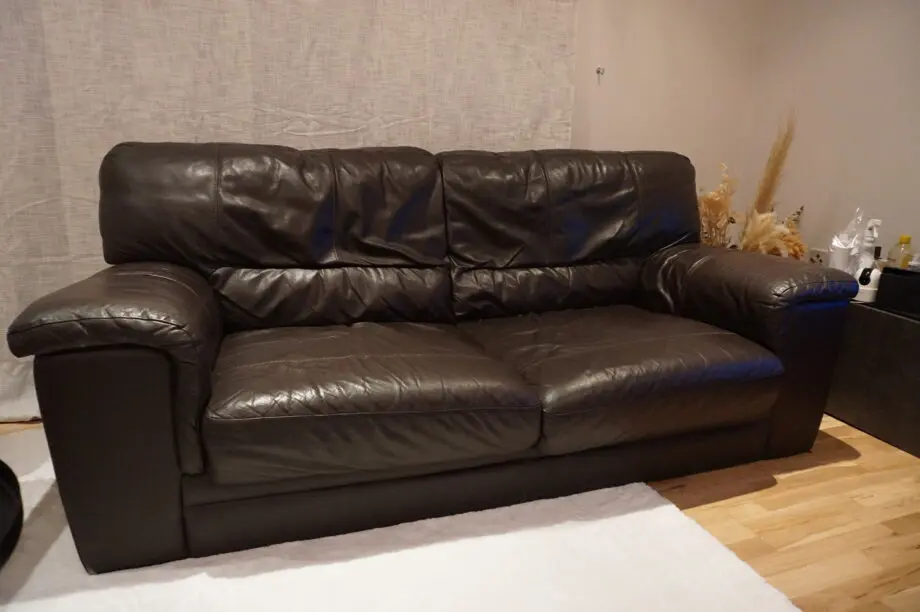 Two seater brown sofa