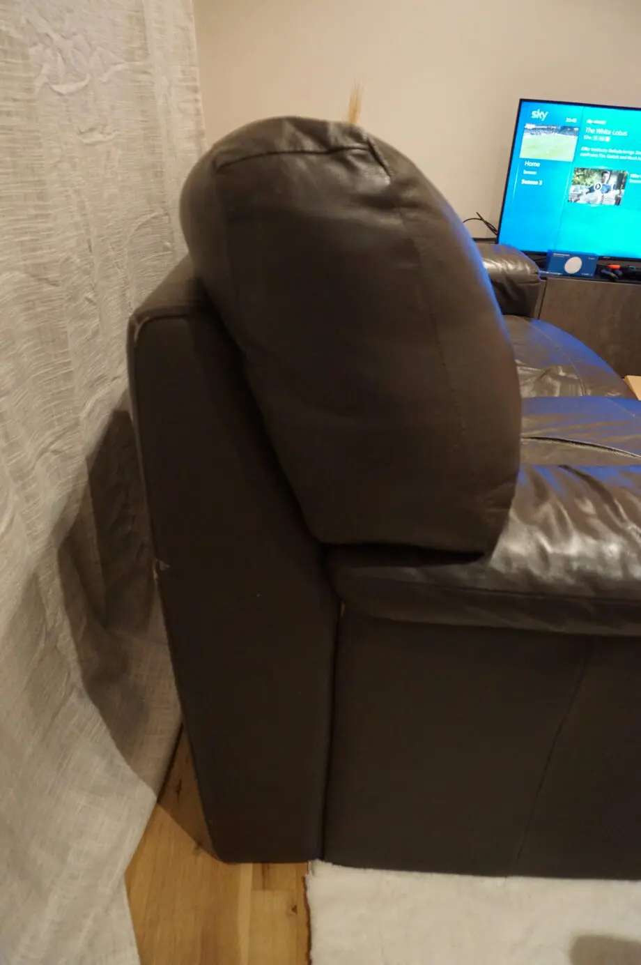 Two seater brown sofa