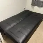 3 seater black faux leather click clack sofa bed